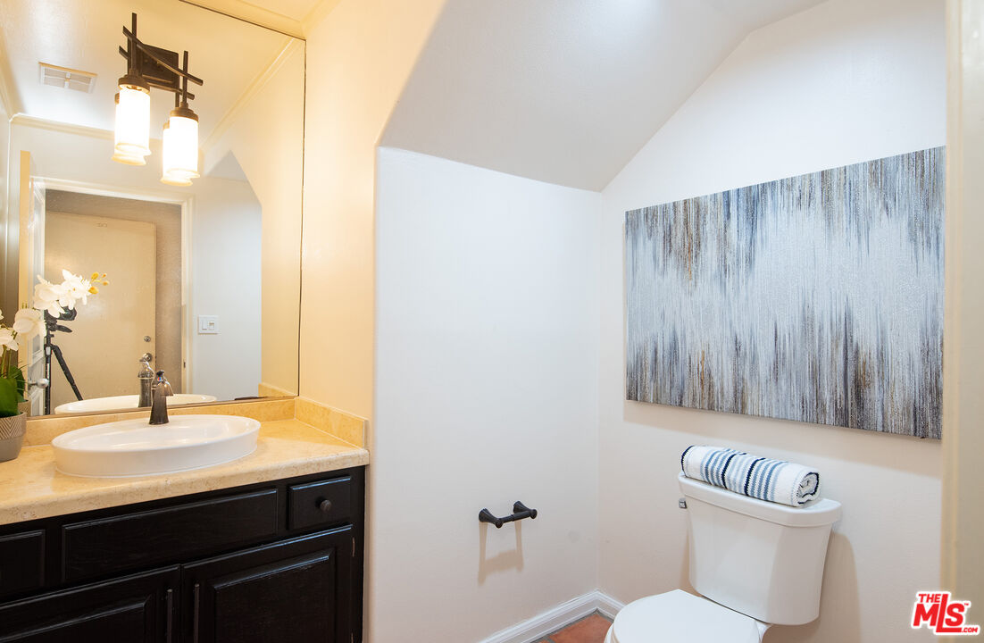 115 Roma Court Marina del Rey, CA 90292 - Photo 37 of 50 a bathroom with a sink a toilet a mirror and shower