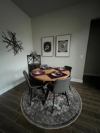 a dining room with a table and chairs