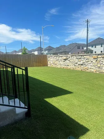a view of a field with an ocean
