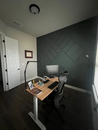 a view of a workspace with furniture