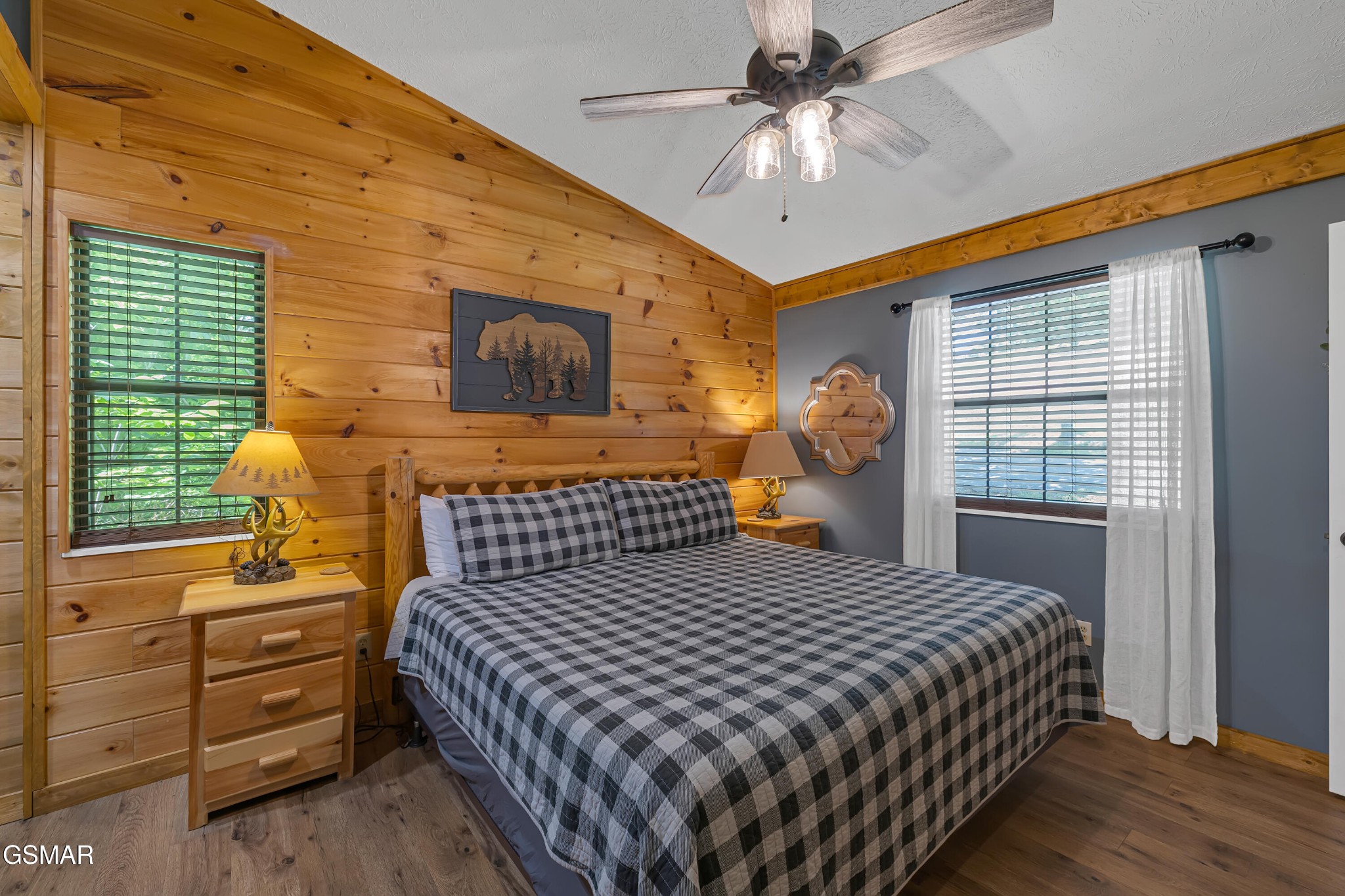 2829 Ridgeway Trail Sevierville, TN 37863 - Photo 13 of 25 a bedroom with a bed and a chandelier