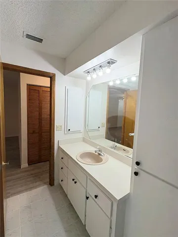 a bathroom with a sink double vanity and a mirror