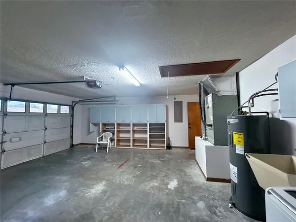 an empty room with wooden floor and furniture