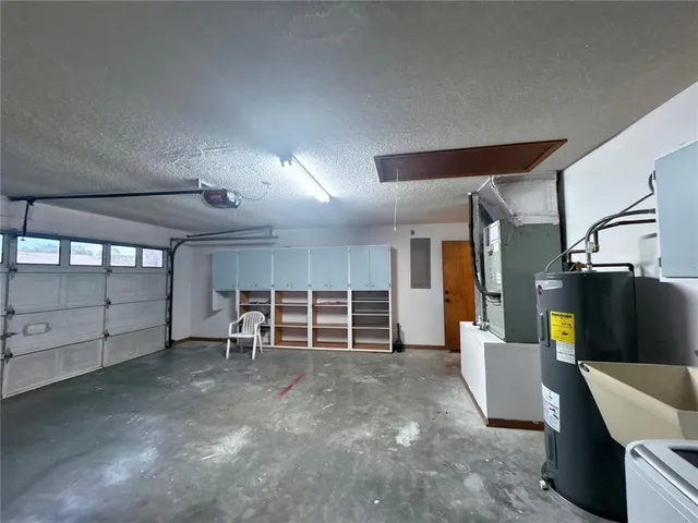 an empty room with wooden floor and furniture
