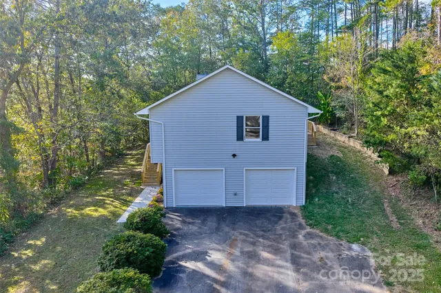 a view of a city with lush green forest