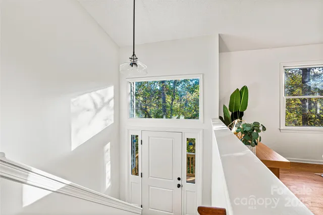 a view of a living room with windows