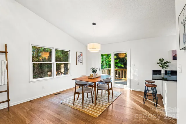 a view of a dining room with furniture window and outside view