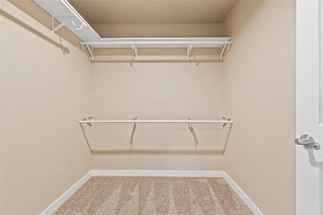 a view of an empty walk in closet