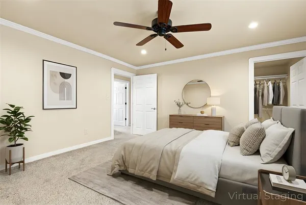 a bedroom with a bed and a potted plant