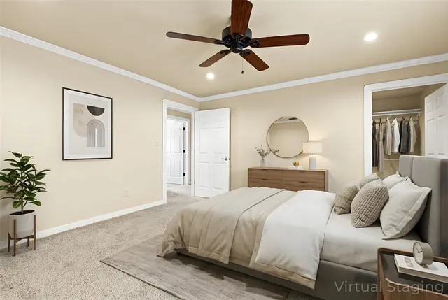 a bedroom with a bed and a potted plant