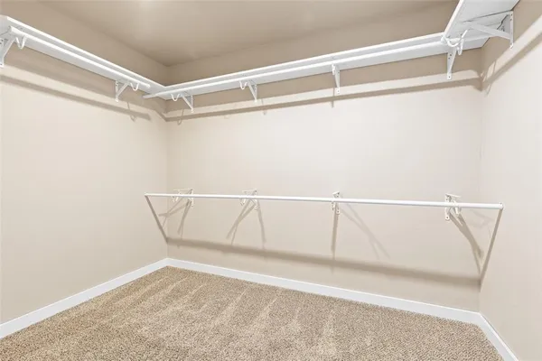 a view of an empty walk in closet