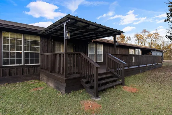 a view of backyard with deck