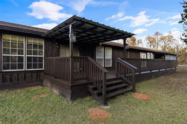 a view of backyard with deck