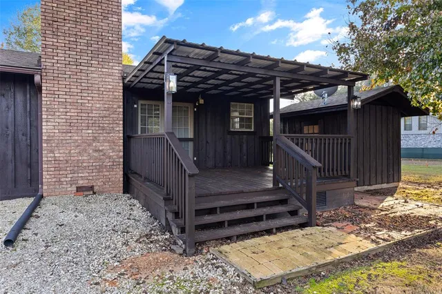 a view of a patio with wooden floor