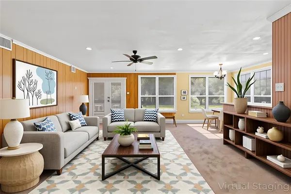 a living room with furniture and a large window