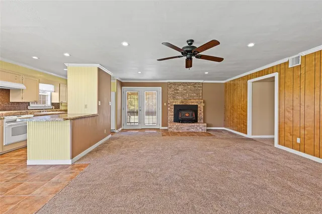 a view of a kitchen with a sink and a refrigerator