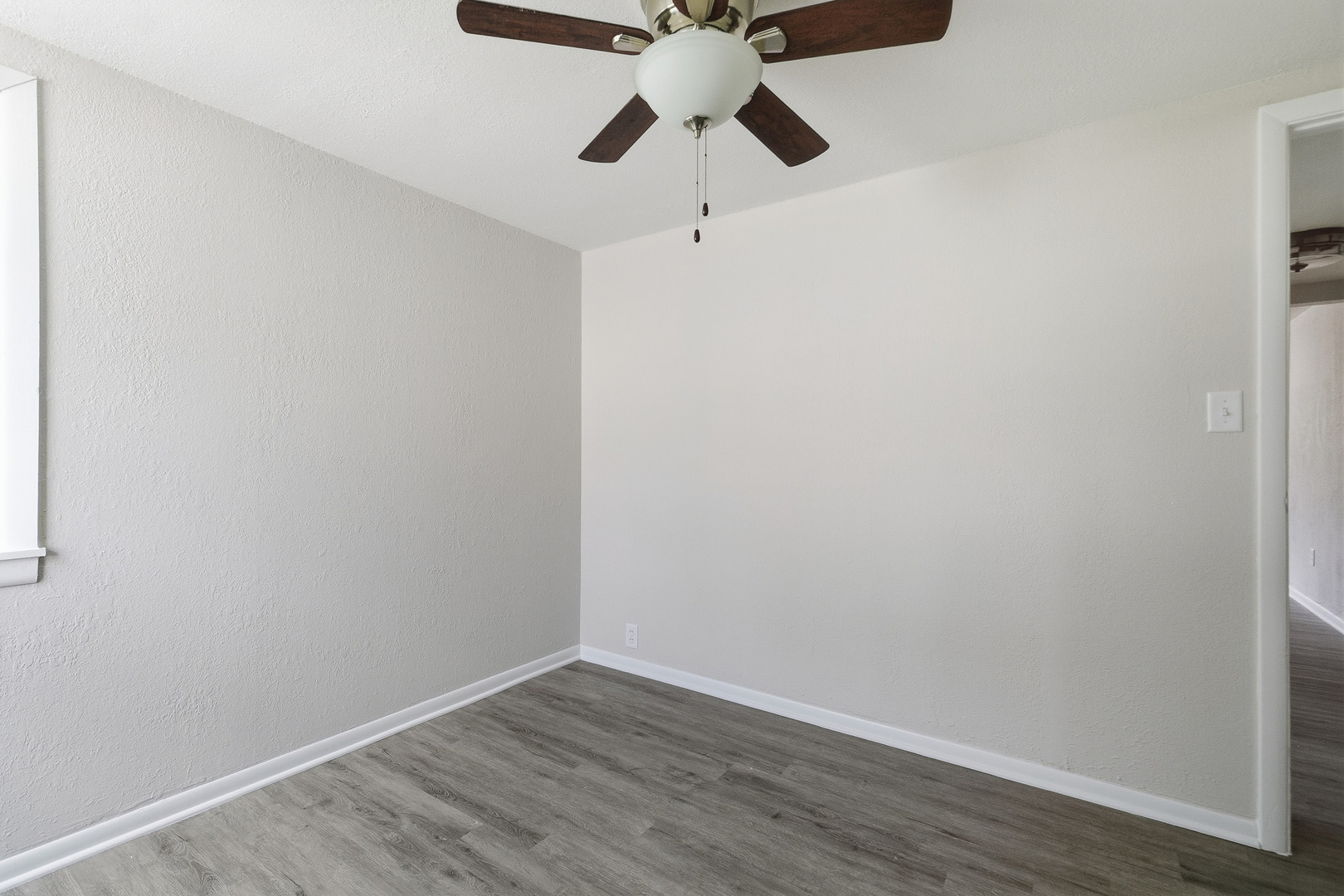 2306 9th Street Silvis, IL 61282 - Photo 30 of 32 a view of an empty room with wooden floor