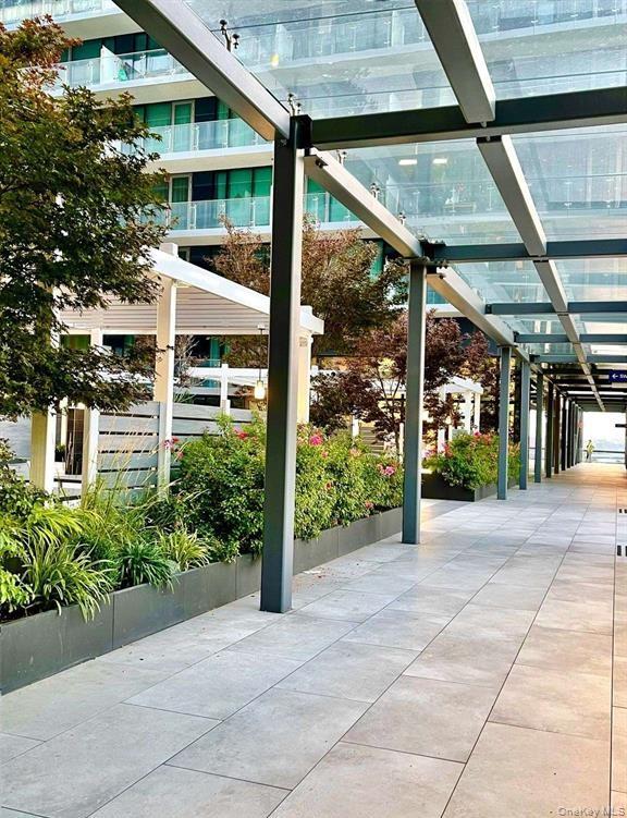 131-03 40 Road, Unit 16D Queens, NY 11354 - Photo 16 of 16 a view of a building with a garden