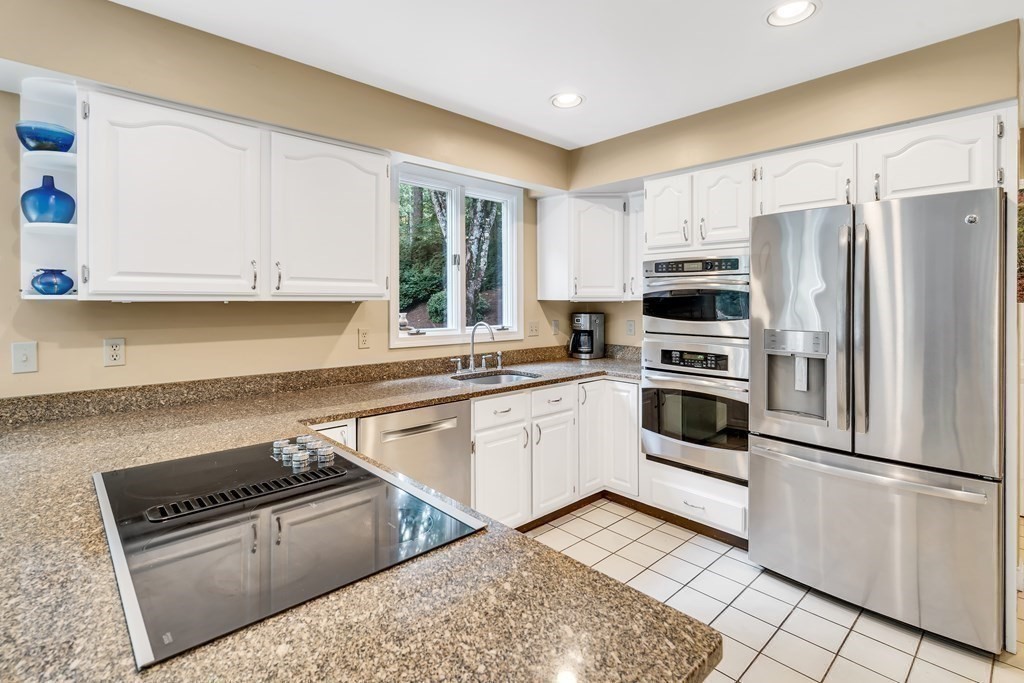 1031 Boston Post Road Sudbury, MA 01776 - Photo 12 of 36 a kitchen with stainless steel appliances granite countertop a stove a sink and a refrigerator