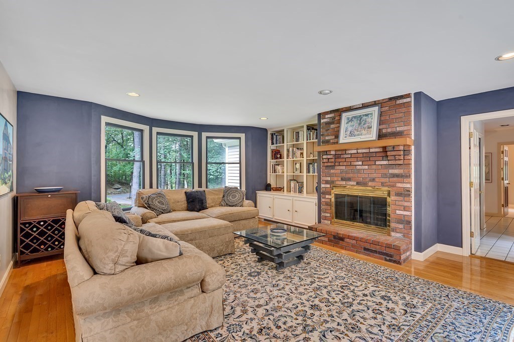 1031 Boston Post Road Sudbury, MA 01776 - Photo 16 of 36 a living room with furniture window and a fireplace