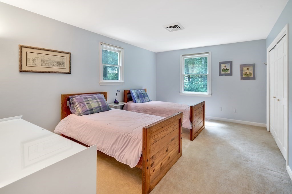 1031 Boston Post Road Sudbury, MA 01776 - Photo 23 of 36 a bedroom with a bed and a window