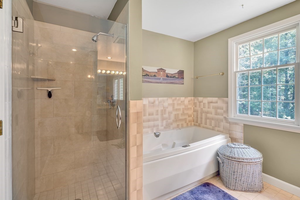 1031 Boston Post Road Sudbury, MA 01776 - Photo 31 of 36 a bathroom with a bathtub and a shower