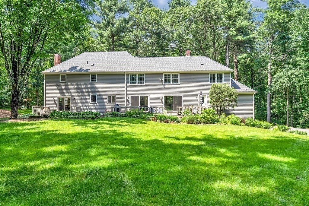 1031 Boston Post Road Sudbury, MA 01776 - Photo 6 of 36 a aerial view of a house next to a yard with large trees