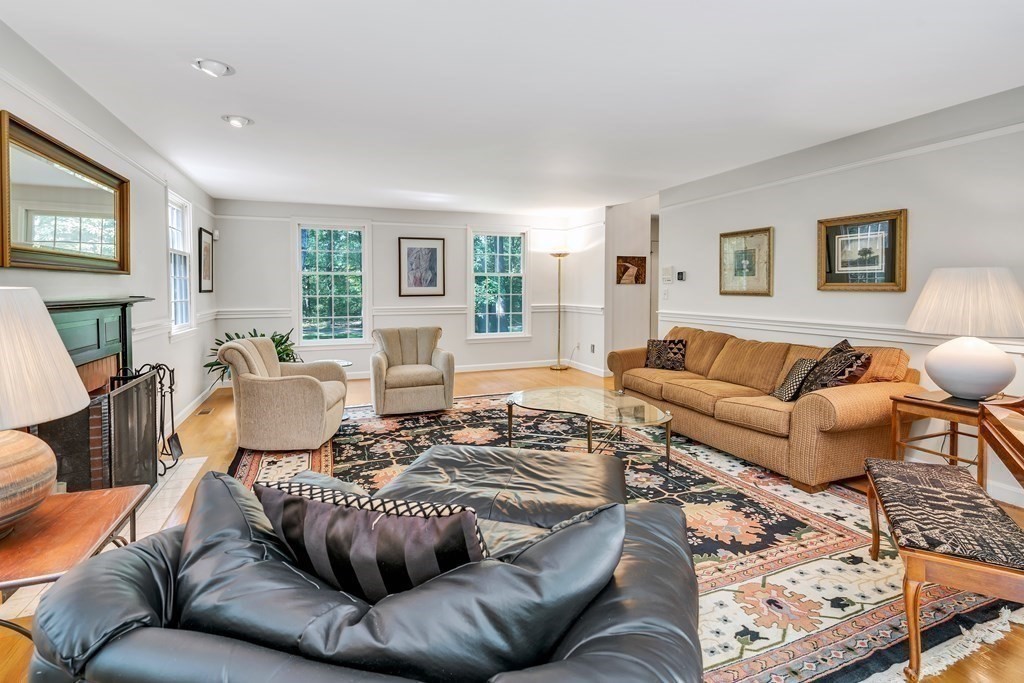 1031 Boston Post Road Sudbury, MA 01776 - Photo 9 of 36 a living room with furniture or couch and a flat screen tv