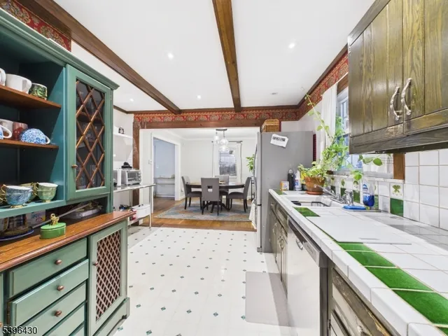 a kitchen with stainless steel appliances granite countertop a sink and cabinets
