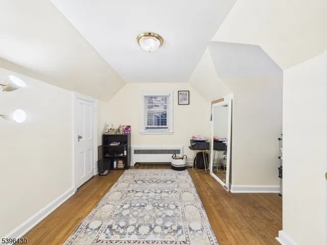 a bed room with a bed and a chair