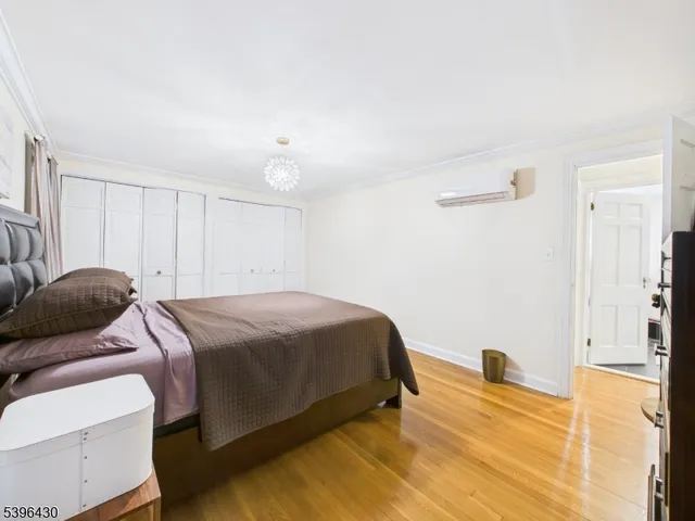 a bedroom with a bed and a walk in closet