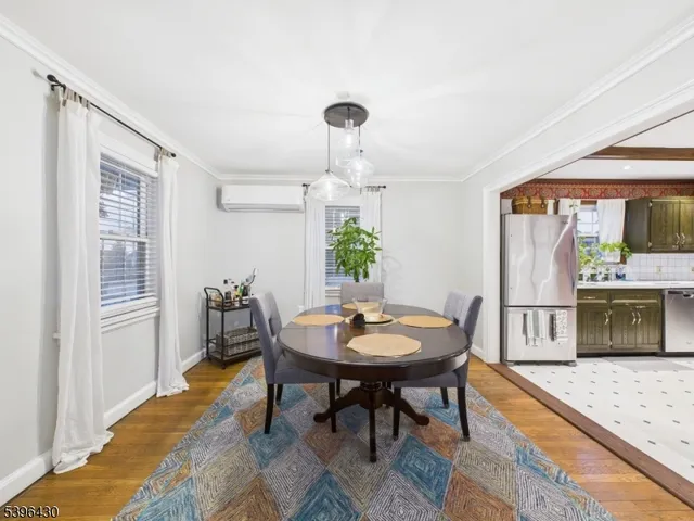 a view of a dining room with furniture and window