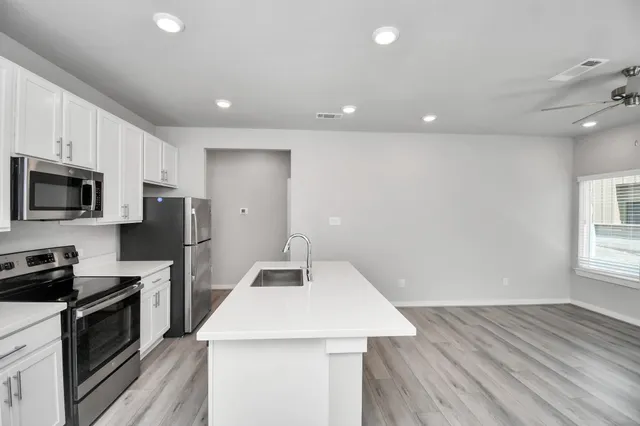 a view of livingroom with washer and dryer