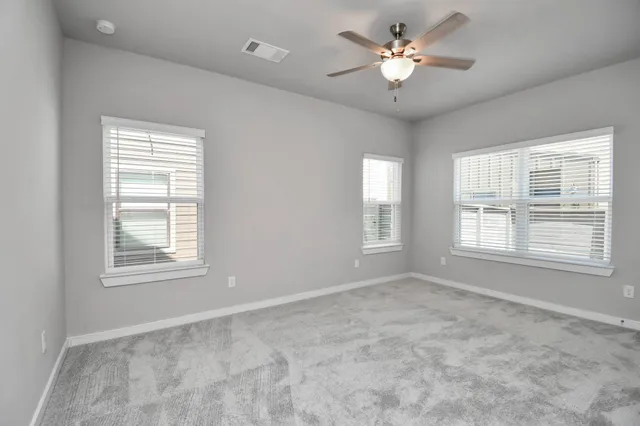 a view of multiple houses with a street