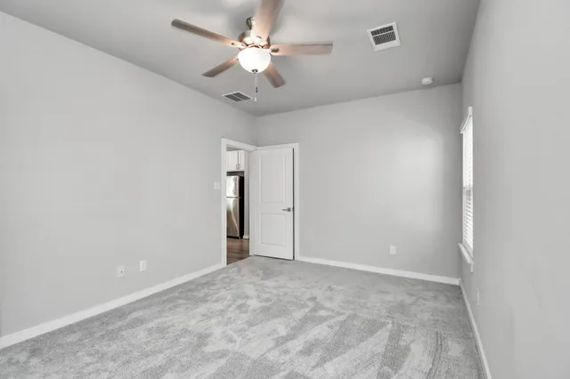 a swimming pool with outdoor seating and barbeque oven