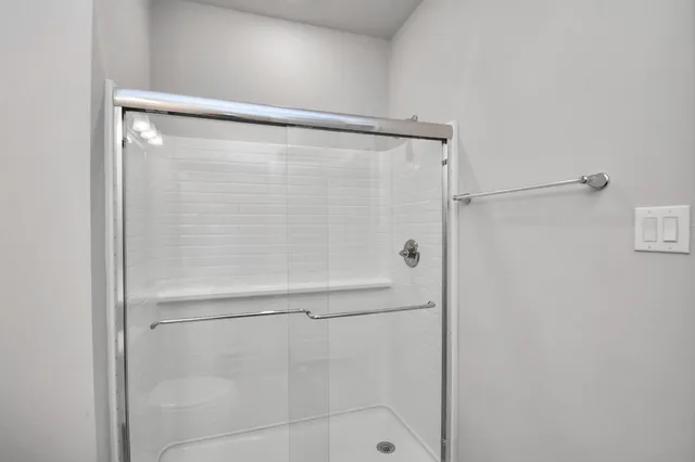 a view of a patio with a table and chairs under an umbrella