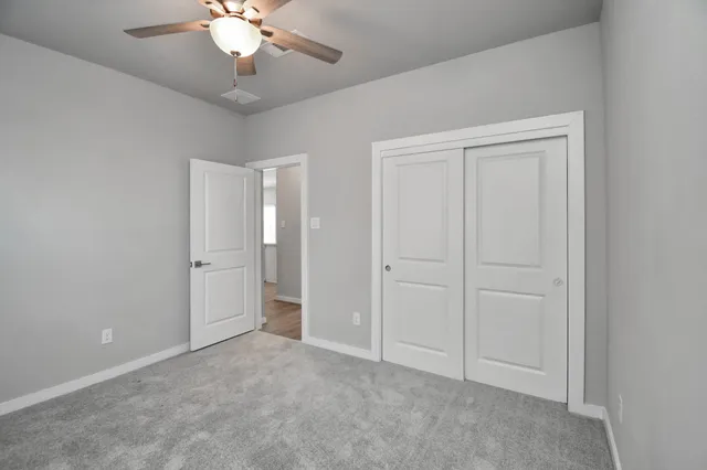 a view of a house with backyard porch and sitting area