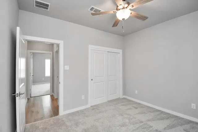 a view of a house with swimming pool and porch