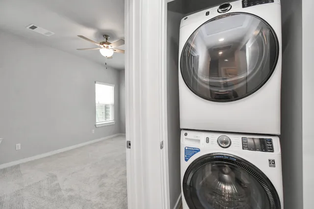 a view of a backyard with a wooden fence