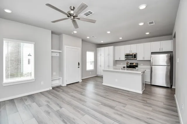 a view of an empty room with a window