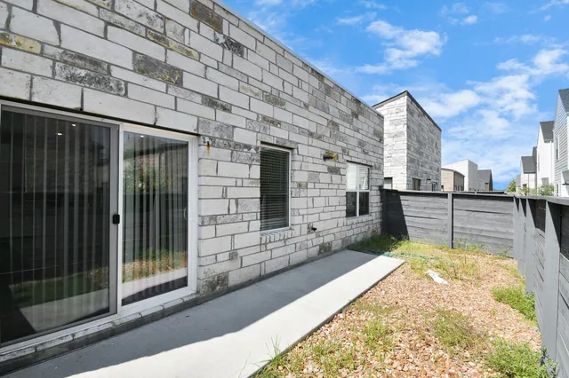 a kitchen with stainless steel appliances granite countertop a refrigerator a stove a sink and a microwave