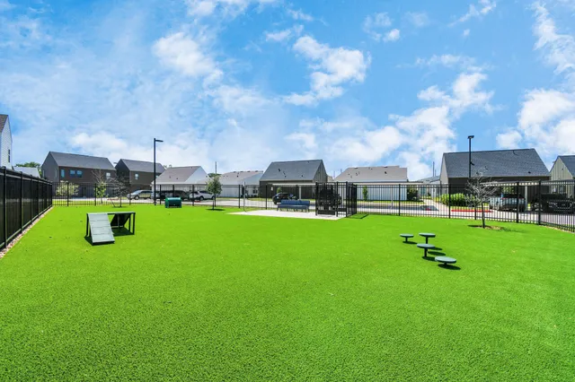 an empty room with a ceiling fan and a window