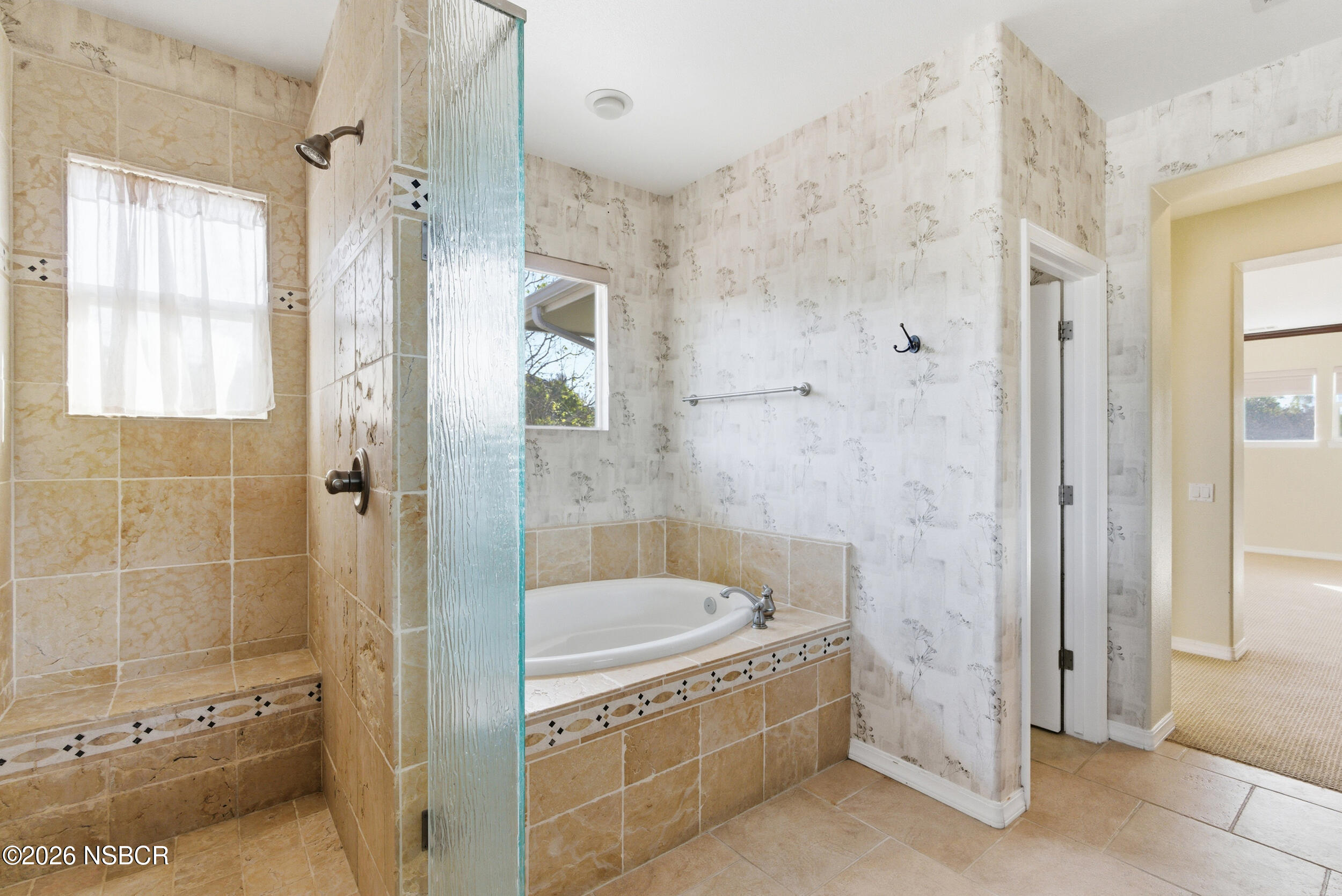 5632 Menemsha Lane Santa Maria, CA 93455 - Photo 33 of 66 a bathroom with a bathtub and shower