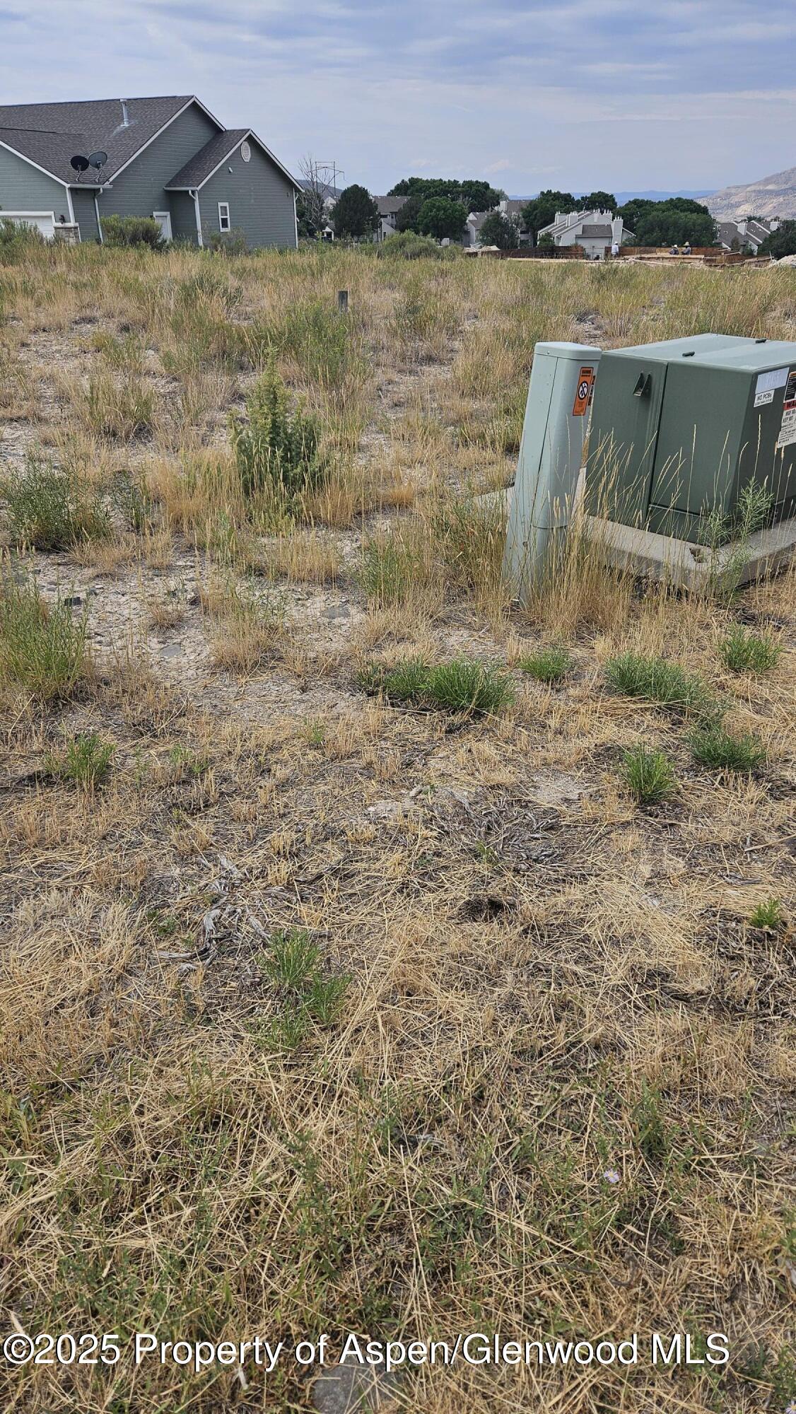 310 Eagle Ridge Drive Parachute, CO 81635 - Photo 2 of 4 a view of a lake with a mountain