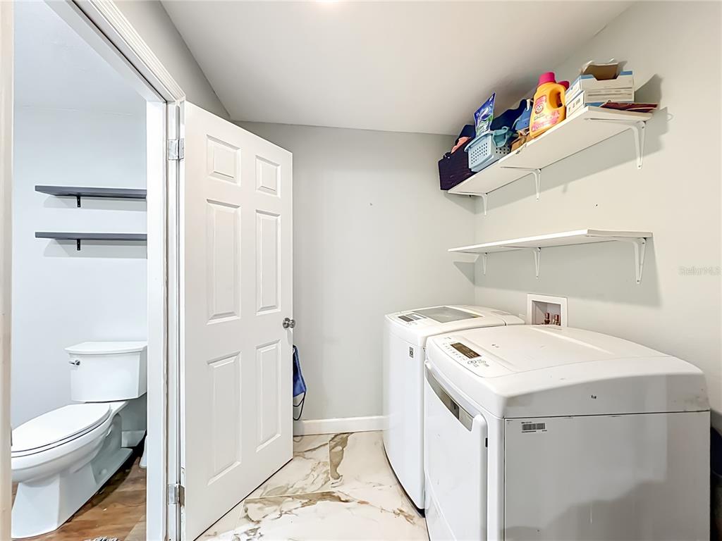 153 Variety Tree Circle Altamonte Springs, FL 32714 - Photo 26 of 44 a utility room with dryer and washer