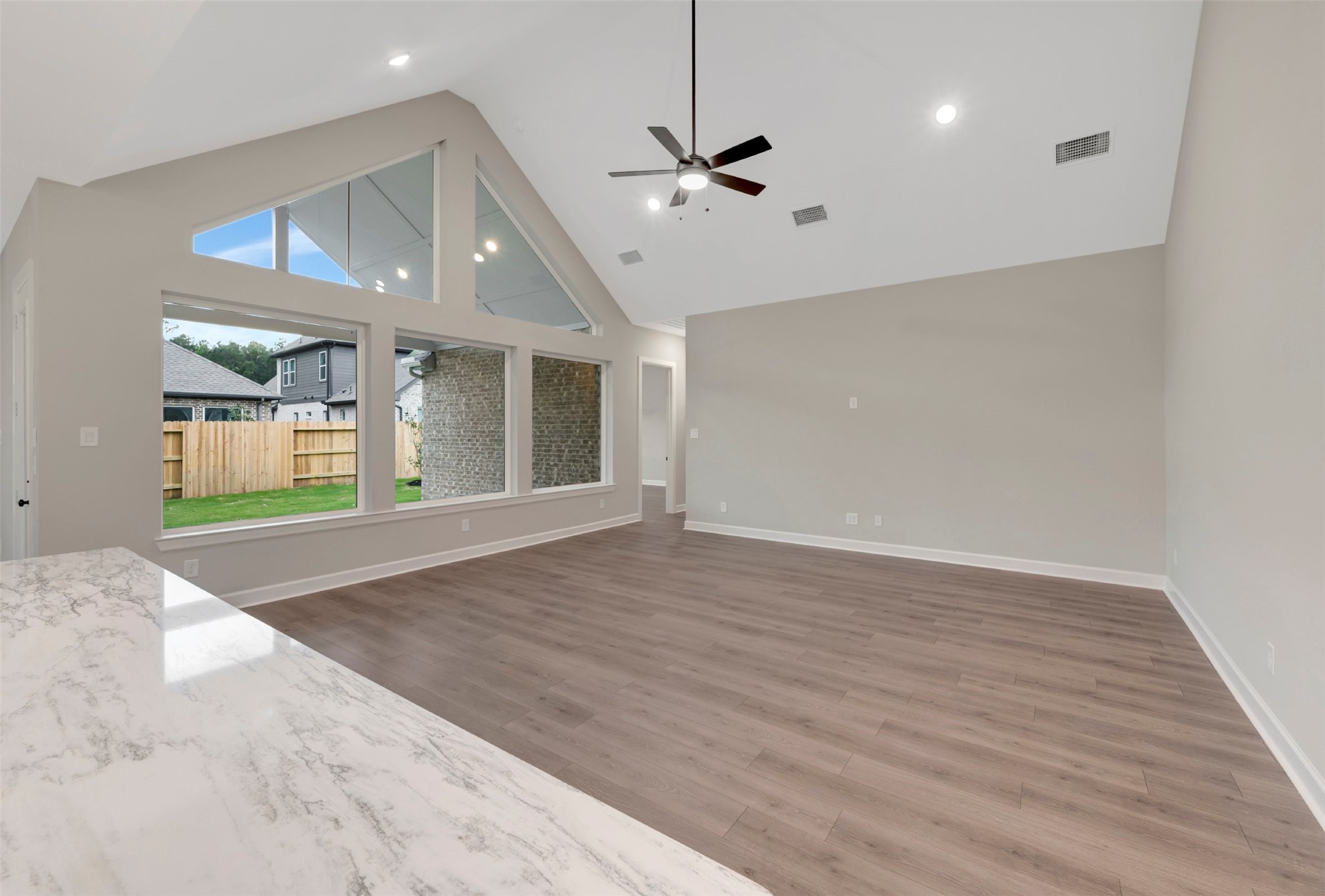 15722 Terracotta Terrace Conroe, TX 77302 - Photo 34 of 50 a view of an empty room with window and wooden floor