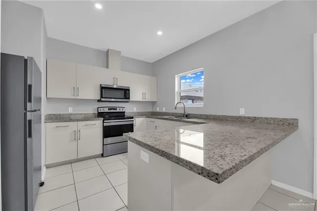 a view of a sink and mirror