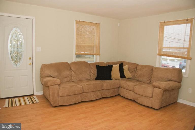 1201 North Point Road Dundalk, MD 21222 - Photo 11 of 17 a living room with furniture and a window