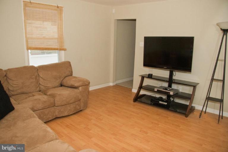 1201 North Point Road Dundalk, MD 21222 - Photo 12 of 17 a living room with furniture and a flat screen tv