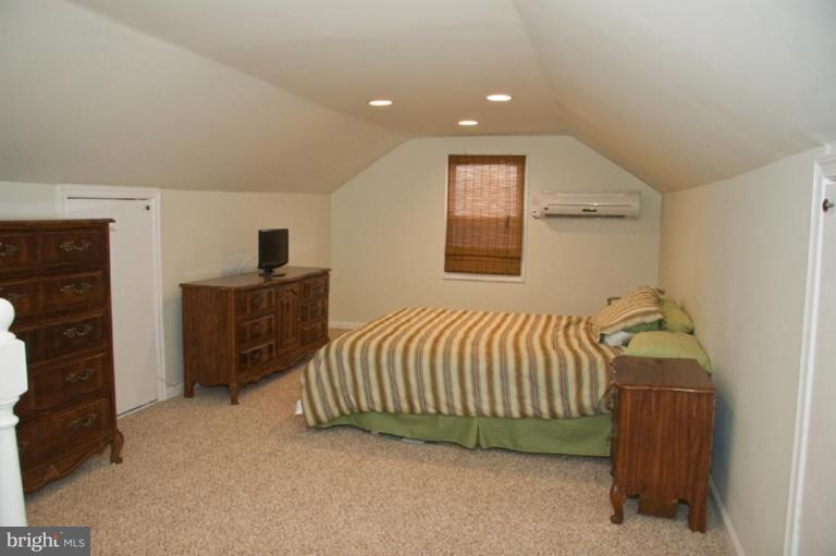 1201 North Point Road Dundalk, MD 21222 - Photo 14 of 17 a bedroom with a bed and a window